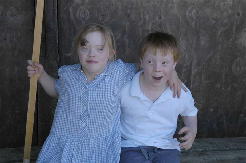 A photograph of children Down syndrome at school.